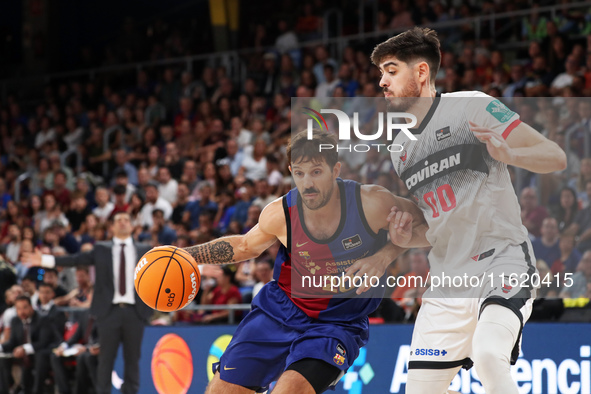 Nicolas Laprovittola and Edgar Vicedo play during the match between FC Barcelona and Coviran Granada, corresponding to week 1 of the Liga En...