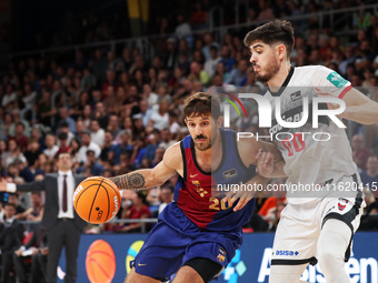 Nicolas Laprovittola and Edgar Vicedo play during the match between FC Barcelona and Coviran Granada, corresponding to week 1 of the Liga En...