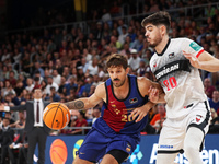 Nicolas Laprovittola and Edgar Vicedo play during the match between FC Barcelona and Coviran Granada, corresponding to week 1 of the Liga En...