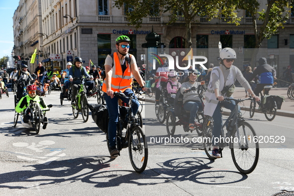 Several hundred people participate in a bike ride in Lyon, France, on September 29, 2024, for the first bike festival. 