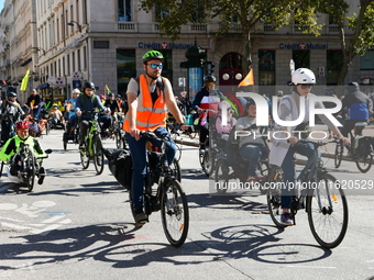 Several hundred people participate in a bike ride in Lyon, France, on September 29, 2024, for the first bike festival. (