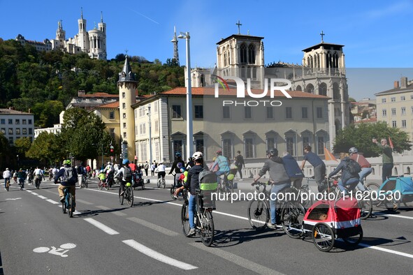 Several hundred people participate in a bike ride in Lyon, France, on September 29, 2024, for the first bike festival. 