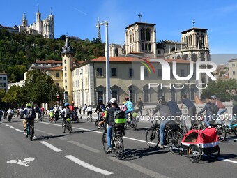 Several hundred people participate in a bike ride in Lyon, France, on September 29, 2024, for the first bike festival. (