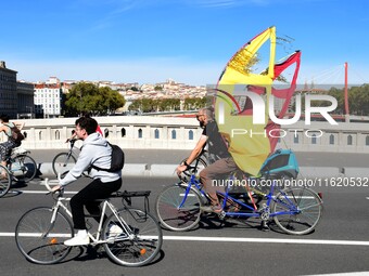 Several hundred people participate in a bike ride in Lyon, France, on September 29, 2024, for the first bike festival. (