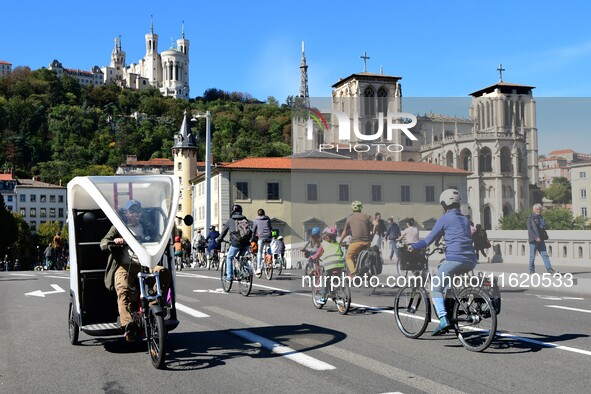 Several hundred people participate in a bike ride in Lyon, France, on September 29, 2024, for the first bike festival. 