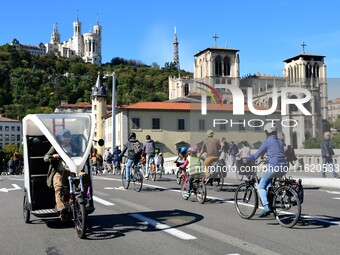 Several hundred people participate in a bike ride in Lyon, France, on September 29, 2024, for the first bike festival. (