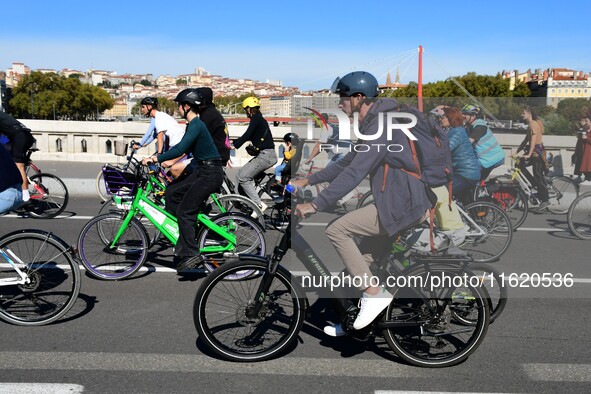 Several hundred people participate in a bike ride in Lyon, France, on September 29, 2024, for the first bike festival. 