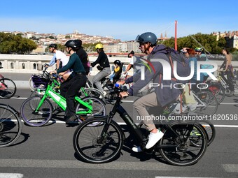 Several hundred people participate in a bike ride in Lyon, France, on September 29, 2024, for the first bike festival. (