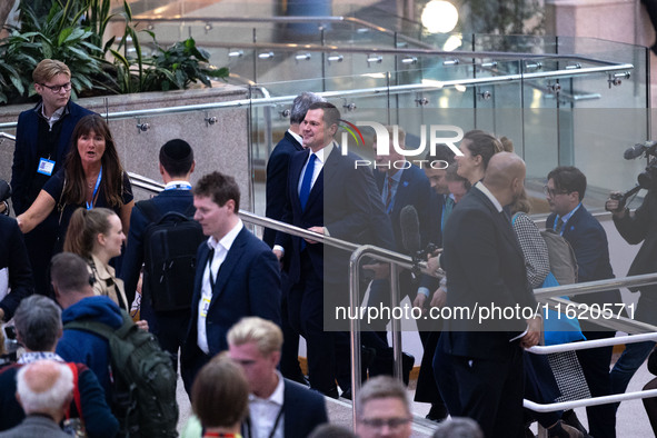 Robert Jenrick MP, the favorite to be the new Tory leader, walks through the ICC surrounded by his security detail at the Conservative Party...