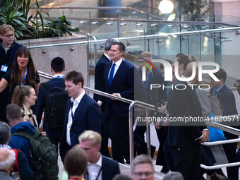 Robert Jenrick MP, the favorite to be the new Tory leader, walks through the ICC surrounded by his security detail at the Conservative Party...