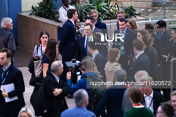 Robert Jenrick MP, the favorite to be the new Tory leader, walks through the ICC surrounded by his security detail at the Conservative Party...