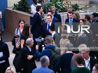 Robert Jenrick MP, the favorite to be the new Tory leader, walks through the ICC surrounded by his security detail at the Conservative Party...