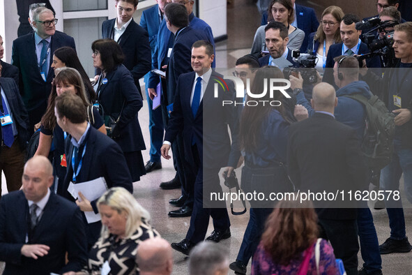 Robert Jenrick MP, the favorite to be the new Tory leader, walks through the ICC surrounded by his security detail at the Conservative Party...