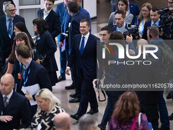 Robert Jenrick MP, the favorite to be the new Tory leader, walks through the ICC surrounded by his security detail at the Conservative Party...