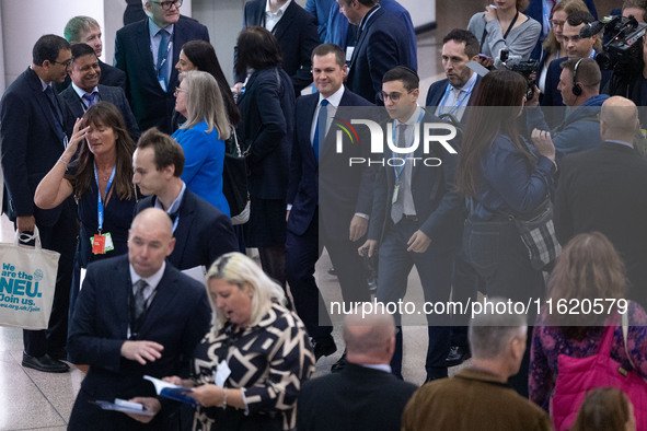 Robert Jenrick MP, the favorite to be the new Tory leader, walks through the ICC surrounded by his security detail at the Conservative Party...