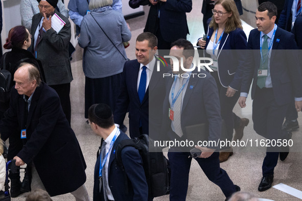 Robert Jenrick MP, the favorite to be the new Tory leader, walks through the ICC surrounded by his security detail at the Conservative Party...