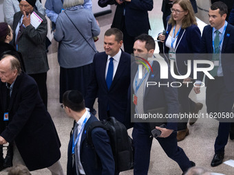 Robert Jenrick MP, the favorite to be the new Tory leader, walks through the ICC surrounded by his security detail at the Conservative Party...