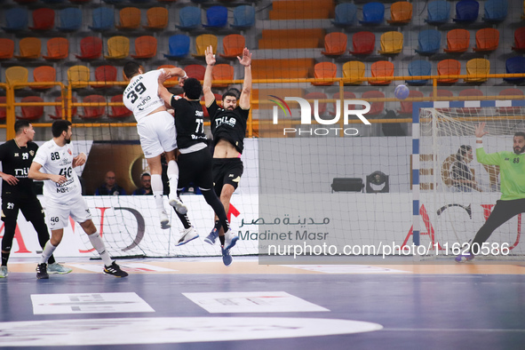 A Veszprem player passes the ball towards the goal during his team's match against Zamalek in the Men's Handball Club World Cup in Cairo. 