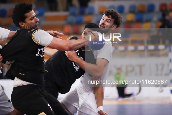 A Zamalek player holds the ball during his team's match against Veszprem of Hungary in the Men's Handball Club World Championship in Cairo 