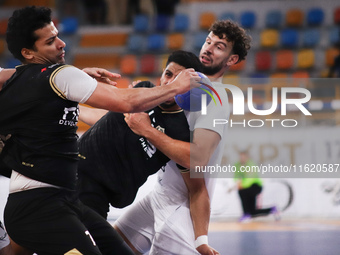 A Zamalek player holds the ball during his team's match against Veszprem of Hungary in the Men's Handball Club World Championship in Cairo (