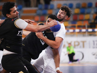 A Zamalek player holds the ball during his team's match against Veszprem of Hungary in the Men's Handball Club World Championship in Cairo (