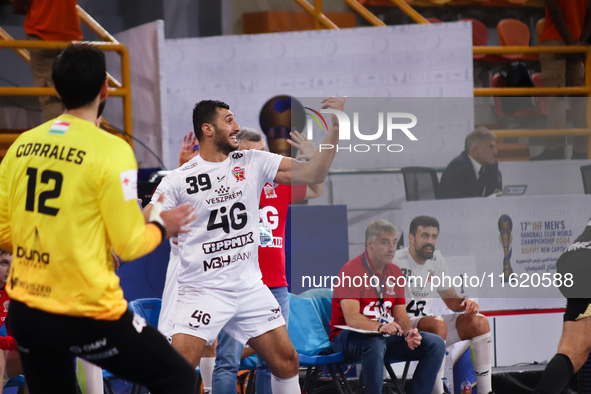 Veszprem player Yehia El-Deraa calls out to his teammate during his team's match against Egypt's Zamalek in the Men's Handball Club World Ch...