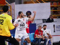 Veszprem player Yehia El-Deraa calls out to his teammate during his team's match against Egypt's Zamalek in the Men's Handball Club World Ch...