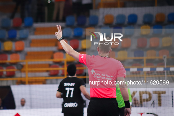 The referee officiates the Zamalek vs Veszprem match in the Men's Club Handball World Championship in Cairo. 