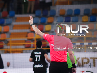 The referee officiates the Zamalek vs Veszprem match in the Men's Club Handball World Championship in Cairo. (