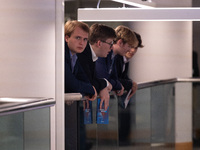 Delegates hang over a balcony at the Conservative Party Conference at the International Conference Centre in Birmingham, United Kingdom, on...