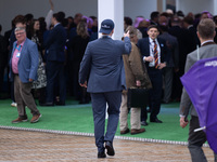 One of Tom Tugendhat's team wears a ''TOM I'M A TUGEND-HAT'' hat backwards at the Conservative Party Conference at the International Confere...