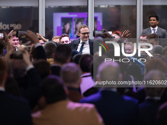 Tom Tugendhat MP gives a speech outside the InHouse marquee at the Conservative Party Conference at the International Conference Centre in B...