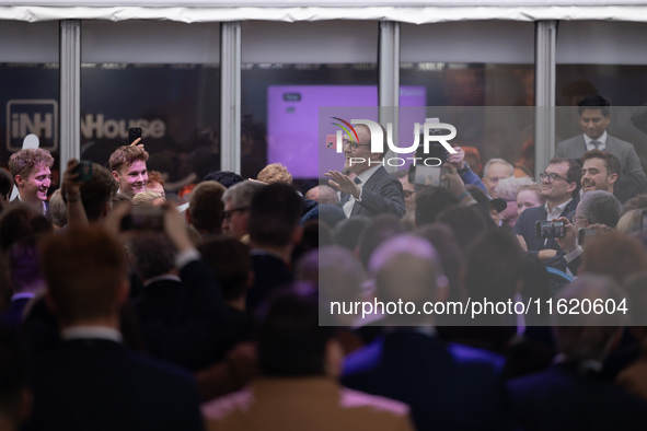 Tom Tugendhat MP gives a speech outside the InHouse marquee at the Conservative Party Conference at the International Conference Centre in B...