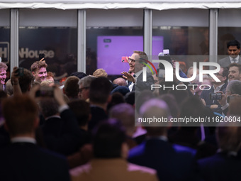 Tom Tugendhat MP gives a speech outside the InHouse marquee at the Conservative Party Conference at the International Conference Centre in B...