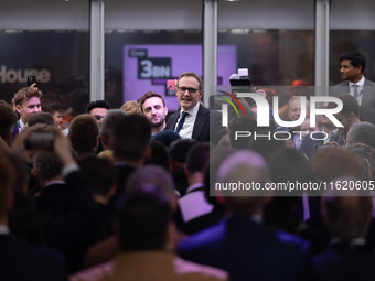 Tom Tugendhat MP gives a speech outside the InHouse marquee at the Conservative Party Conference at the International Conference Centre in B...