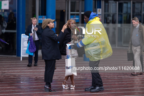 A delegate is not dressed for the Birmingham weather at the Conservative Party Conference at the International Conference Centre in Birmingh...