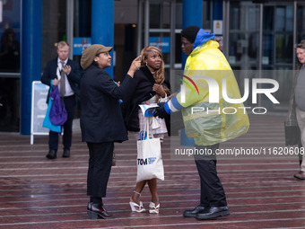 A delegate is not dressed for the Birmingham weather at the Conservative Party Conference at the International Conference Centre in Birmingh...