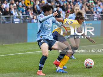 Jorelyn Carabali #16 of Brighton & Hove Albion W.F.C. is challenged by Aoba Fujino #20 of Manchester City W.F.C. during the Barclays FA Wome...