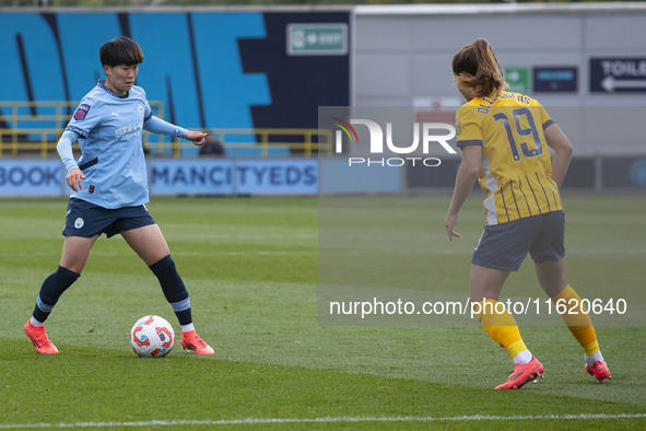 Aoba Fujino #20 of Manchester City W.F.C. possesses the ball during the Barclays FA Women's Super League match between Manchester City and B...