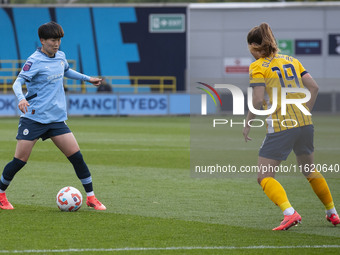 Aoba Fujino #20 of Manchester City W.F.C. possesses the ball during the Barclays FA Women's Super League match between Manchester City and B...