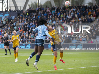 Khadija Shaw #21 of Manchester City W.F.C. heads the ball during the Barclays FA Women's Super League match between Manchester City and Brig...