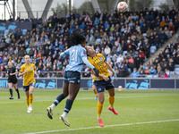 Khadija Shaw #21 of Manchester City W.F.C. heads the ball during the Barclays FA Women's Super League match between Manchester City and Brig...