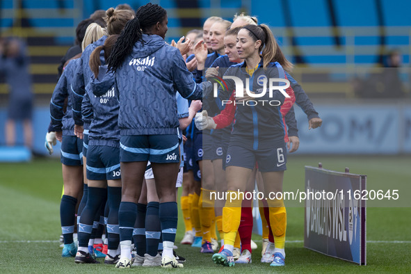 Manchester City W.F.C. and Brighton & Hove Albion W.F.C. shake hands before the match during the Barclays FA Women's Super League match betw...