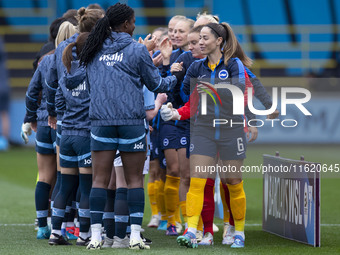 Manchester City W.F.C. and Brighton & Hove Albion W.F.C. shake hands before the match during the Barclays FA Women's Super League match betw...