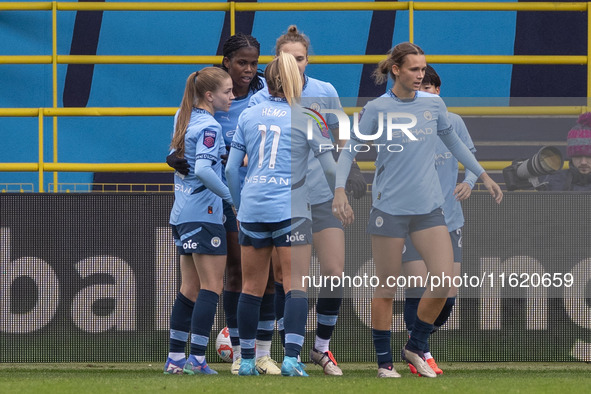 Khadija Shaw #21 of Manchester City W.F.C. celebrates her goal with teammates during the Barclays FA Women's Super League match between Manc...