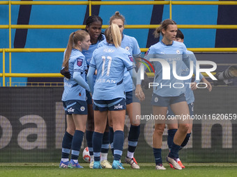 Khadija Shaw #21 of Manchester City W.F.C. celebrates her goal with teammates during the Barclays FA Women's Super League match between Manc...