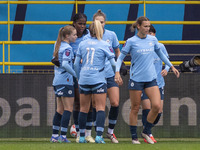 Khadija Shaw #21 of Manchester City W.F.C. celebrates her goal with teammates during the Barclays FA Women's Super League match between Manc...