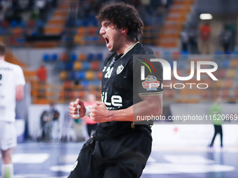 Zamalek's Youssef celebrates his goal during his team's match against Hungary's Veszprem in the Men's Handball Club World Championship in Ca...