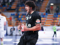 Zamalek's Youssef celebrates his goal during his team's match against Hungary's Veszprem in the Men's Handball Club World Championship in Ca...