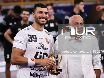 Yehia El-Deraa, Veszprem player, receives the Man of the Match award in the Zamalek vs Veszprem match in the Men's Handball Club World Champ...